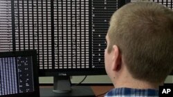 An American government cyber security agent looks at code at a cyber defense lab in Idaho