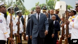 In this April 7, 2018, file photo, Haiti's President Jovenel Moise, center, leaves the museum during a ceremony marking the 215th anniversary of revolutionary hero Toussaint Louverture's death, at the National Pantheon museum in Port-au-Prince, Haiti. (AP Photo/Dieu Nalio Chery)