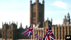British Union flags fly in front of The Houses of Parliament in London, Jan. 22, 2019. British Prime Minister Theresa May launched a mission to resuscitate her rejected European Union Brexit divorce deal, setting out plans to get it approved by Parliament.