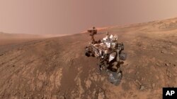 This composite image made from a series of Jan. 23, 2018 photos shows a self-portrait of NASA's Curiosity Mars rover on Vera Rubin Ridge. (NASA/JPL-Caltech/MSSS via AP)