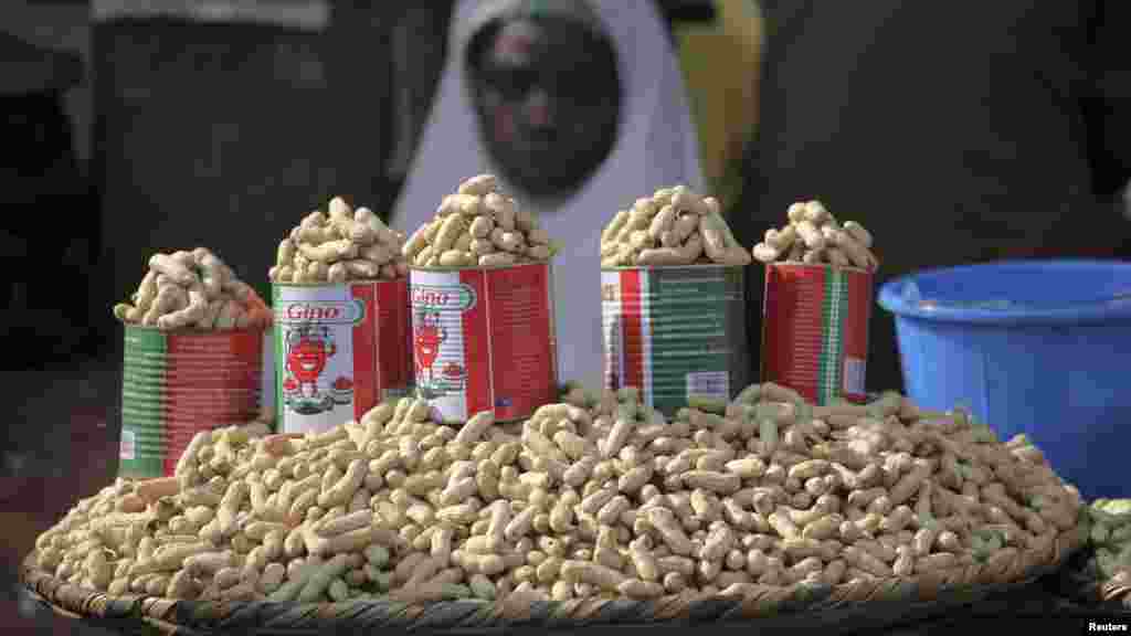 Groundnuts are displayed for sale at a roadside stall.