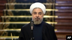 Presiden Iran Hassan Rouhani dalam konferensi pers di Tehran (9/4). 