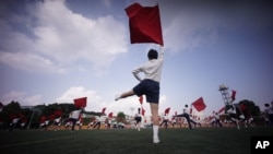 Students practice flag cheering routines at a Tokyo Korean junior and senior high school in Tokyo, Sept. 26, 2017. Many third- and fourth-generation descendants of Koreans brought to Japan during the imperialist years before and during World War II remain loyal to their roots.