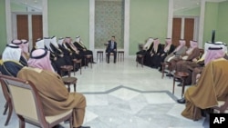 Syria's President Bashar al-Assad (C) meets a delegation of clan leaders from three cities in nation's northeastern region - Deir Ezzour, Raqqa and Hasaka - in Damascus, Syria, December 22, 2011.