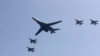 FILE - A U.S. B-1 bomber, center, flies over Osan Air Base with U.S. jets in Pyeongtaek, South Korea, Tuesday, Sept. 13, 2016.