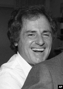 FILE - This Dec. 13, 1985 file photo shows TV sportscaster Warner Wolf. Warner Wolf, the sportscaster who popularized the phrase "Let's go to the videotape."