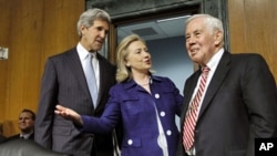 Secretary of State Hillary Clinton talks with Senate Foreign Relations Committee Chairman Sen. John Kerry (L), and the committee's ranking Republican, Sen. Richard Lugar on Capitol Hill, June 23, 2011, prior to testifying on U.S. policies in Afghanistan a