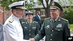 Navy Adm. Mike Mullen, Chairman of the Joint Chiefs of Staff, greets General Chen Bingde, Chief of the General Staff, People's Liberation Army, People's Republic of China at Comny Hall Joint Base Myer-Henderson Hall on May 17, 2011.