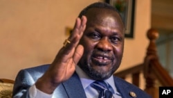 FILE - South Sudan rebel leader Riek Machar talks to reporters in Addis Ababa, Ethiopia, Feb. 13, 2016. Machar fled from Juba in January shortly after heavy fighting broke out in the capital between Machar’s forces and South Sudan army forces.