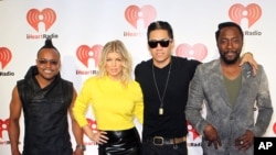 From left, Apl.de.Ap, Fergie, Taboo, and will.i.am, of the band the Black Eyed Peas arrive at the iHeartRadio music festival, Sept. 23, 2011, in Las Vegas.