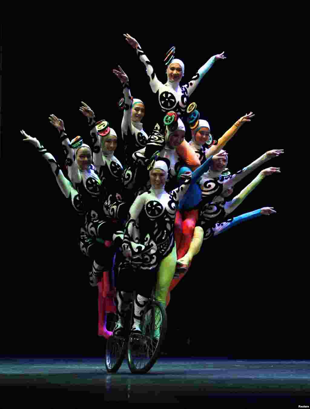 The China National Acrobatic Troupe performs at the Spring of Culture concert in Manama, Bahrain.