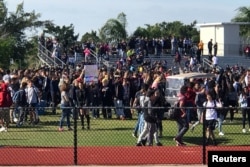 Students walkout at Marjory Stoneman Douglas High School during National School Walkout to protest gun violence in Parkland, Florida, March 14, 2018.
