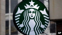 FILE - The Starbucks logo is seen at a shop in downtown Pittsburgh, Pennsylvania, March 14, 2017.