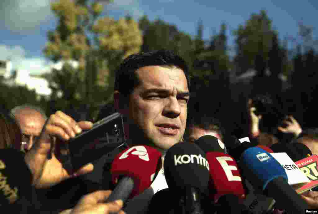 Alexis Tsipras, opposition leader and head of radical leftist Syriza party, talks to reporters outside the parliament building after the last round of presidential voting, Athens, Dec. 29, 2014.&nbsp;