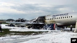 The Sukhoi Superjet 100 aircraft of Aeroflot Airlines is covered in fire retardant foam after an emergency landing in Sheremetyevo airport in Moscow. Picture: Moscow News Agency via APSource:AP