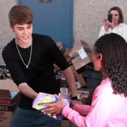 A Warner Brothers photo of Justin Bieber handing out toys to students at Whitney Elementary School in Las Vegas, Nevada, on December 16. Bieber and "The Ellen DeGeneres Show" presented the students with $100,000 in toys for the holidays.