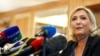 Leader of France's National Rally Party Marine Le Pen speaks during a news conference in Milan, Italy, May 18, 2019. 