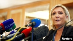 Leader of France's National Rally Party Marine Le Pen speaks during a news conference in Milan, Italy, May 18, 2019. 