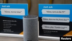 FILE - Prompts on how to use Amazon's Alexa personal assistant are seen in an Amazon "experience center" in Vallejo, California, May 8, 2018.
