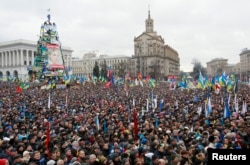 Supporters of EU integration are seen at a rally at Independence Square in central Kyiv, December 8, 2013.