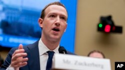 FILE - Facebook CEO Mark Zuckerberg testifies before a House Energy and Commerce hearing on Capitol Hill in Washington about the use of Facebook data to target American voters in the 2016 election and data privacy, April 11, 2018.