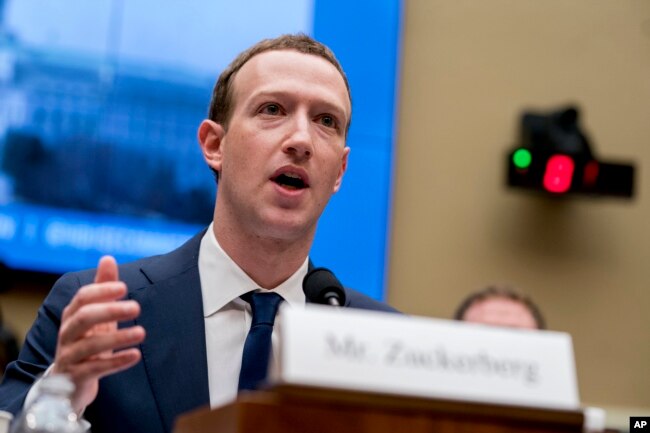 FILE - Facebook CEO Mark Zuckerberg testifies before a House Energy and Commerce hearing on Capitol Hill in Washington about the use of Facebook data to target American voters in the 2016 election and data privacy, April 11, 2018.