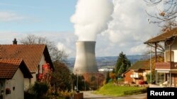  Steam emerges from a cooling tower of the nuclear power plant Leibstadt near Leibstadt, Switzerland, Nov. 18, 2014.