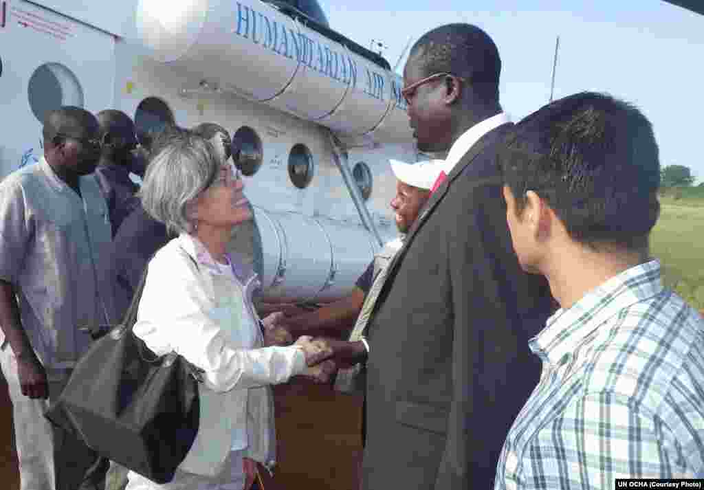 UN Assistant Secretary General Kyung-Wha Kang (L.) is welcomed to Bor, capital of Jonglei state in South Sudan, by Gabriel Deng Ajak, the Relief and Rehabilitation Commission Director for the state.