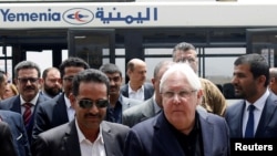 FILE - U.N. envoy to Yemen Martin Griffiths, center, arrives at Sana'a, Yemen, July 2, 2018.