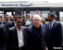 FILE - U.N. envoy to Yemen Martin Griffiths, center, arrives at Sana'a, Yemen, July 2, 2018.