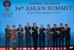 Leaders of the Association of Southeast Asian Nations (ASEAN) pose for a group photo during the opening ceremony of the ASEAN leaders summit in Bangkok, Thailand, June 23, 2019.