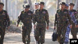 Myanmar's army chief, Senior General Min Aung Hlaing (C), is seen arriving with senior military officials to observe military exercises in Myanmar's Ayeyarwaddy Delta region, February 3, 2018.