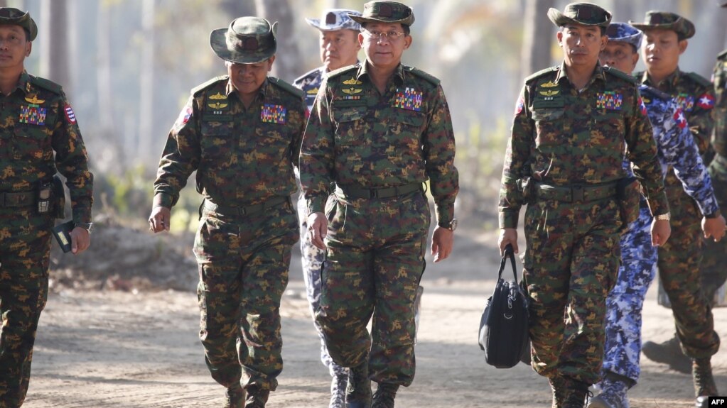 FILE - Myanmar's army chief, Senior General Min Aung Hlaing (C), is seen arriving with senior military officials to observe military exercises in Myanmar's Ayeyarwaddy Delta region, Feb. 3, 2018.