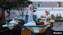 A swing in the form of a missile is seen at a kindergarten and day care for employees' children at a silk factory during a government-organized visit for foreign reporters ahead of the 70th anniversary of North Korea's foundation in Pyongyang, North Korea, Sept. 7, 2018. 