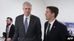 Supreme Court nominee Judge Neil Gorsuch, left, walks with Sen. Ben Sasse (R-NE) at the Capitol Hill in Washington, D.C., Feb. 7, 2017. 