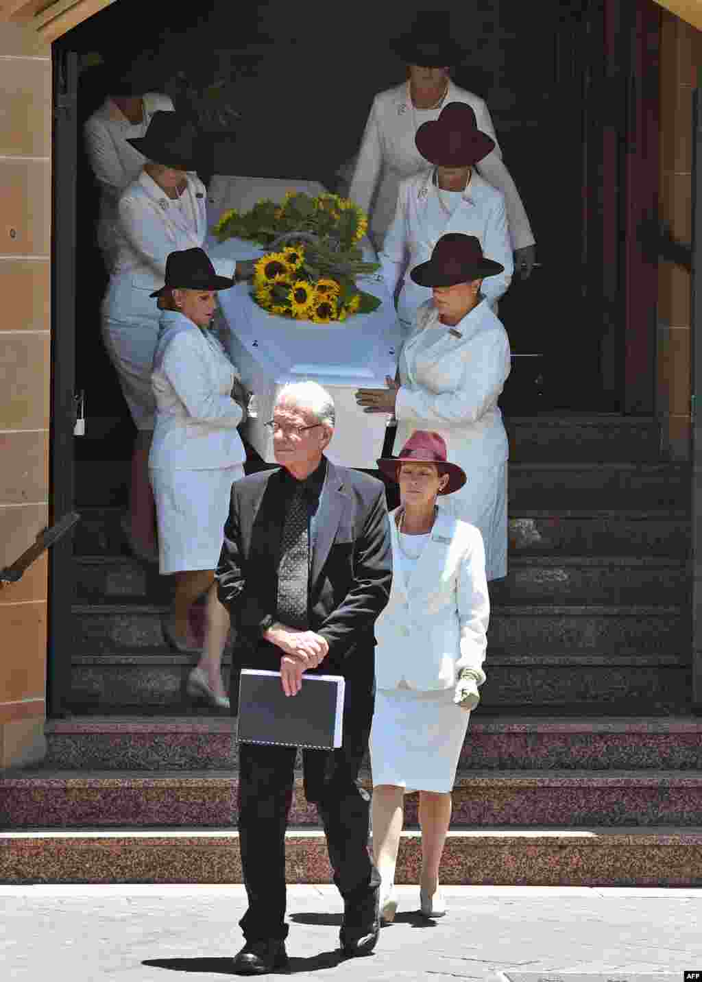 The coffin of Sydney siege victim Tori Johnson is carried to the hearse after a funeral service in Sydney, Australia. A private funeral was held for Johnson -- hailed a hero after reportedly trying to wrestle the gun from gunman Iranian-born gunman Man Haron Monis.