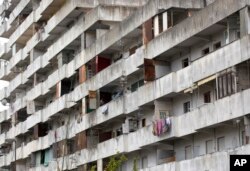 A view of one of the buildings of “Le Vele di Scampia,” (the Sails of Scampia), a public housing project which for over a decade was the center for the Camorra Mafia syndicate's drug business, in Naples, southern Italy, Feb. 12, 2018.
