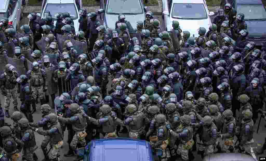 Law enforcement officers gather to disperse opposition supporters during a rally to protest against the Belarus presidential election results in Minsk, Belarus.