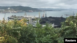 In this file photo, piles of coal are seen in the Astafyev Cape area of the far eastern port of Nakhodka, Russia Sept. 5, 2017.