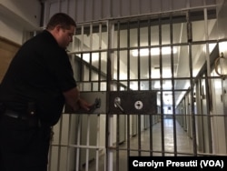 A correction officer secures a gate at the medium security Maryland Correctional Institution in Hagerstown, Maryland.