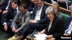 FILE - Prime Minister Theresa May talks about Brexit 'plan B' in Parliament, in London, Britain, Jan. 29, 2019.