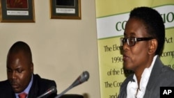 Electoral Commission of Zambia director Priscilla Isaacs, flanked by deputy director for Information Technology Brown Rasaro (left), speaking during a press briefing for the September 20, 2011 elections in Lusaka.