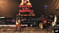 Members of Indian-controlled Kashmir’s first all-girl rock band Praagaash, or First Light, perform at the annual 'Battle of the Bands' in Srinagar, India, Dec. 23, 2012.