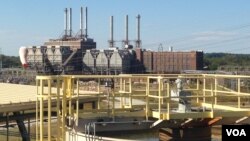 In 2011, Duke Energy shuttered its coal-fired power plant, at rear, and opened a new plant that runs on natural gas. Its water-treatment facility appears, in foreground, in Rowan County, North Carolina. (N. Yaqub/VOA)