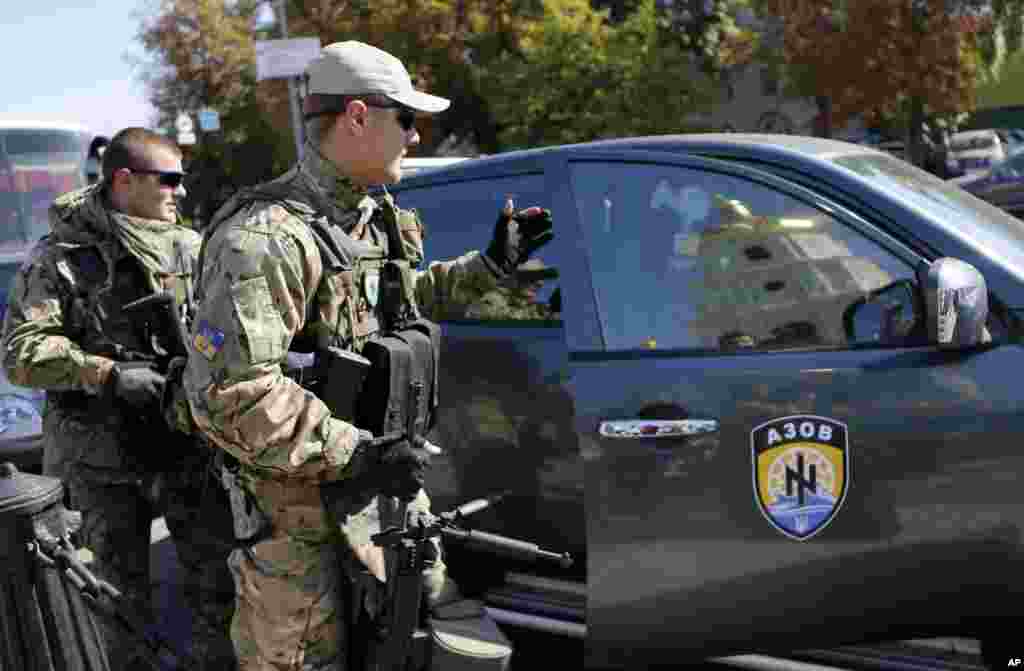 Fighters from the Azov volunteer battalion arrive on rotation from the front line in Kyiv, Ukraine, Sept. 15, 2014.