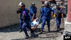Ba policiers bakangi moto moko na Goma, RDC, 27 décembre 2018.