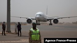 FILE - A plane is seen parked at the airport in Bamako, Mali, March 5, 2021.