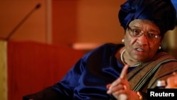 FILE - President of Liberia Ellen Johnson Sirleaf makes a point during an onstage newsmakers interview with Reuters journalist Axel Threlfall in Washington.