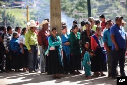 People wait to vote at a polling station during general elections in the indigenous community of Soledad Atzompa, Veracruz state, Mexico, July 1, 2018.