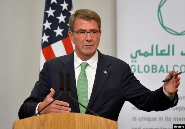 FILE - Former U.S. Secretary of Defense Ash Carter attends a press conference.